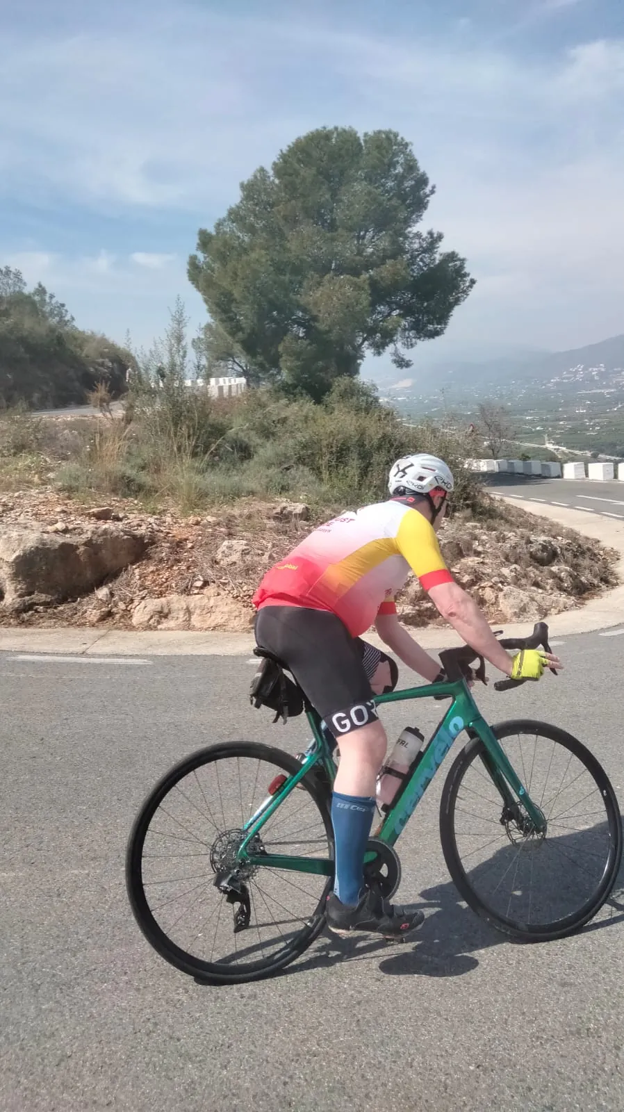 Road cyclist climbing a Costa Blanca mountain road
