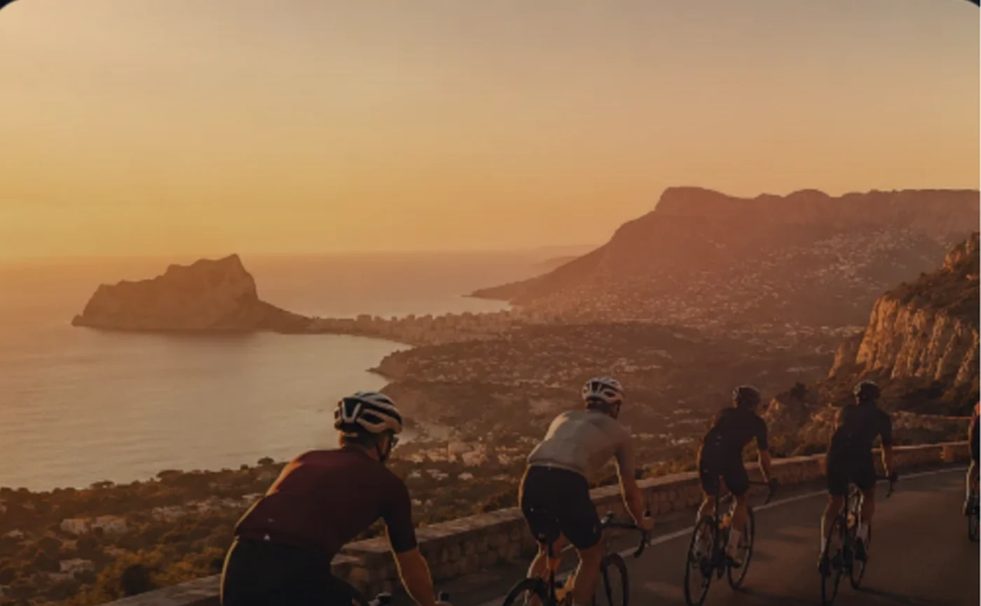 Road cycling group descending from the mountains towards the Costa Blanca coast